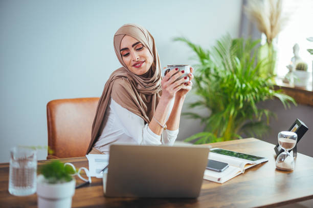 istock A positive Arab woman in a hijab drinks coffee 1399527417
