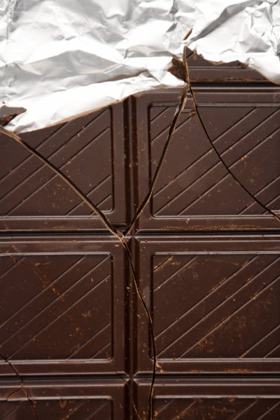 istock Chocolate bar pieces in the foil package 1399530151