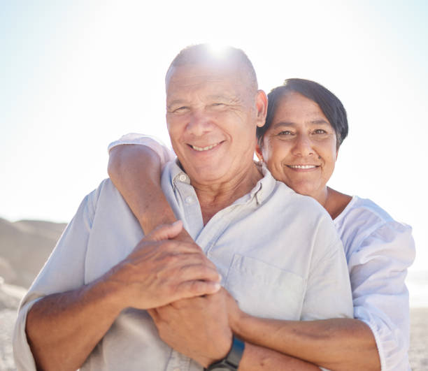 istock Affectionate mature mixed race couple sharing an intimate moment on the beach. Senior husband and wife enjoying a summer day by the sea. They love spending time together on the coast at sunset 1399530855