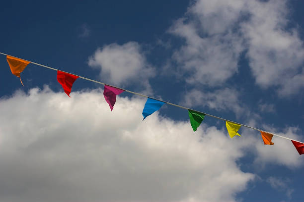 istock Colorful flags against a blue sky 1399531431