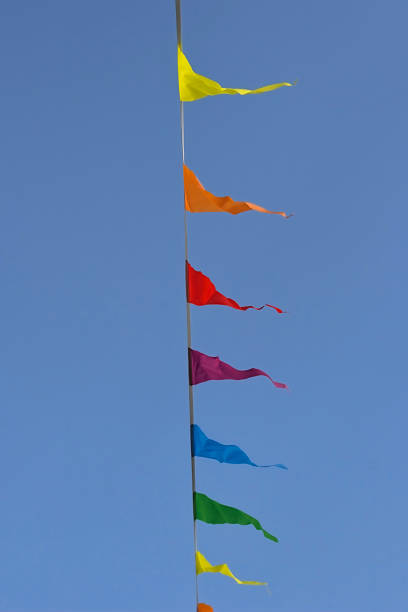 istock Colorful flags against a blue sky 1399531546