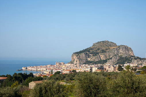 View of Cefalu town and rock in Sicily island, Italy