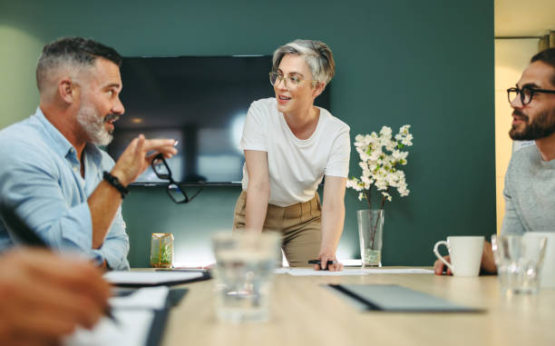 istock Mature businesspeople having a discussion in a boardroom 1399532062