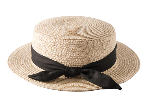 Small-brimmed straw boater hat with black band. Canotier - Summer French straw hat of rigid shape with a cylindrical crown and straight, rather narrow brim. Concept summer fashion clothing accessories