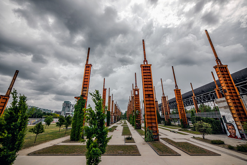 Turin, Italy - May 4, 2022: Post-industrial area of Parco Dora, located on former 90's factories. Today is a public park that includes a soccer park, a skate park and a lot of green spaces.