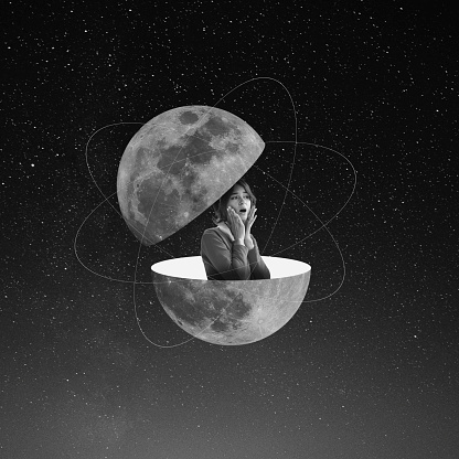 Spooky night. Shocked young woman sticks out from split planet isolated on dark starry background. Monochrome. Surrealism, outer space. Concept of creativity, art, imagination and minimalism