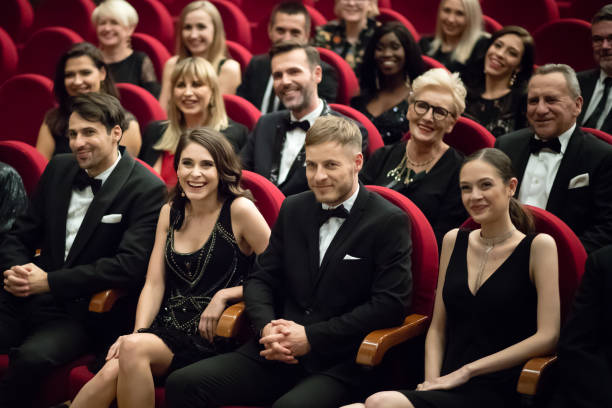 istock Happy audience sitting in opera house 1399536382