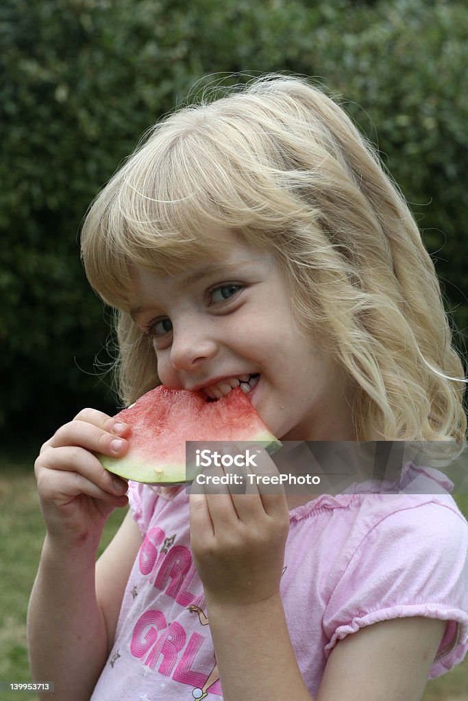 Yummy watermelon #2 Three year old girl eats a slice of watermelon.  See others in series. Activity Stock Photo