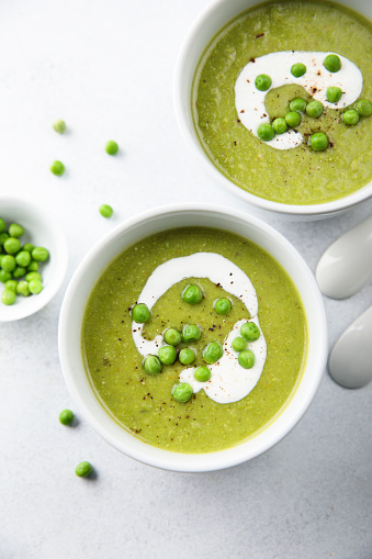 Homemade green pea soup with cream
