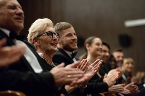 istock Spectators clapping in the theater, close up of hands 1399537730