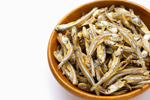 istock Dried anchovy on white background 1399537944
