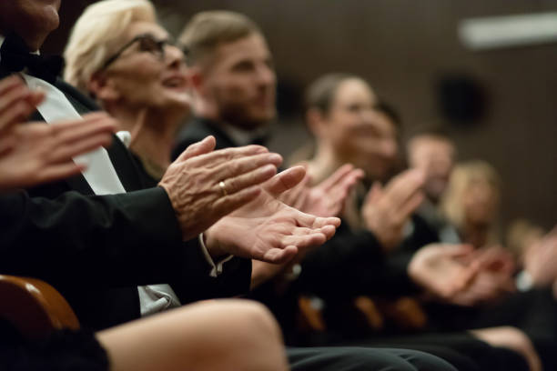 istock Spectators clapping in the theater, close up of hands 1399538025