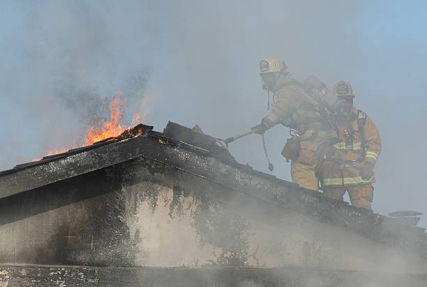 Fire fighter at work 3 stock photo