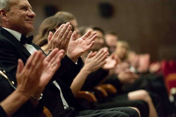 istock Spectators clapping in the theater, close up of hands 1399538892