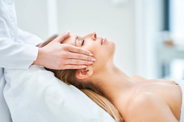 istock Young nice woman having face massage in spa 1399539601