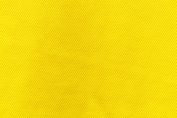 istock Yellow color fabric cloth polyester texture and textile background. 1399539892
