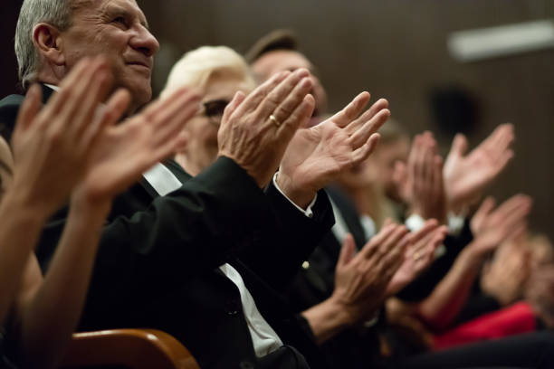 istock Spectators clapping in the theater, close up of hands 1399539933