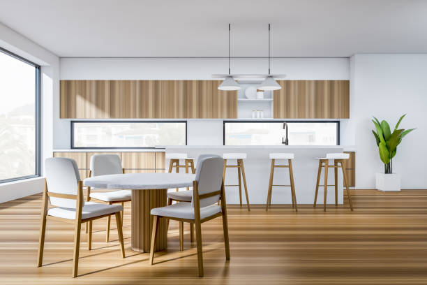 istock Modern kitchen interior with table and seats, island and panoramic window 1399539973