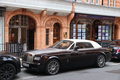 Rolls-Royce Phantom coupe luxury car parked in London. There are 37.7 million vehicles registered in the UK.