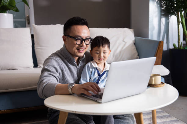 istock Father with his son using laptop at home 1399540758