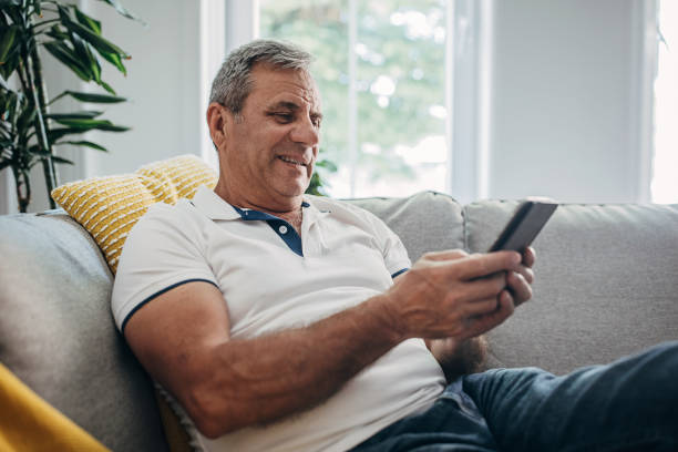 istock An older man uses wireless technology, a smartphone 1399542830