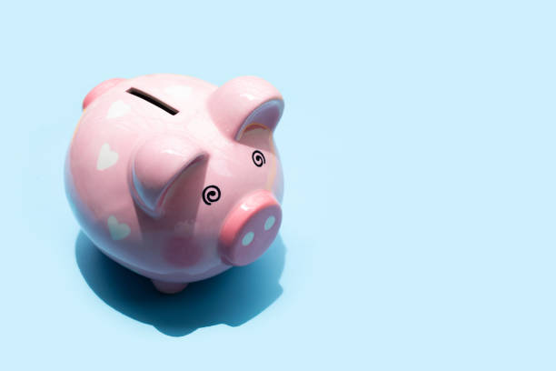 istock Pinggy bank on blue background. 1399543072