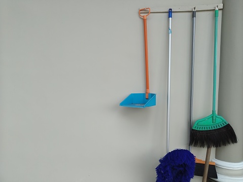 Some cleaning tools hanging on the wall