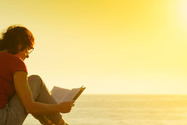 istock Woman on sea read book, relaxing 1399551018