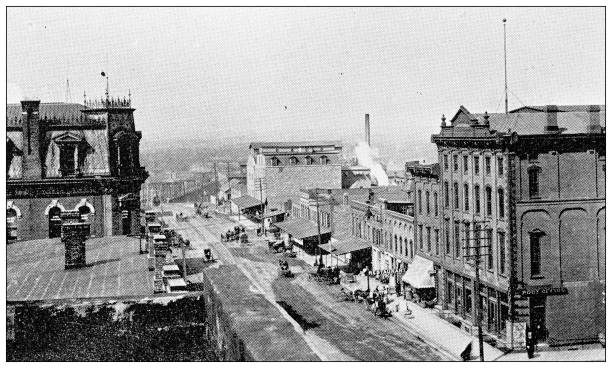 Antique photograph from Lawrence, Kansas, in 1898: Massachusetts Street Antique photograph from Lawrence, Kansas, in 1898: Massachusetts Street lawrence kansas stock illustrations