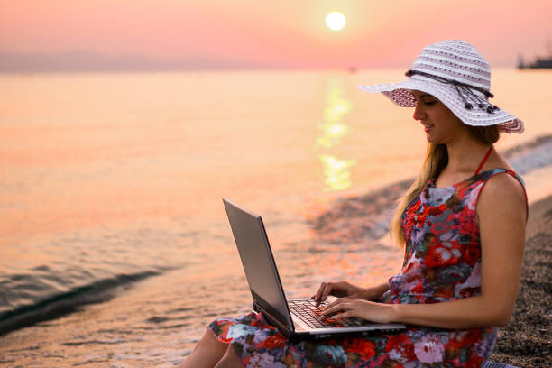 istock Woman working an online job while on vacation 1399554134