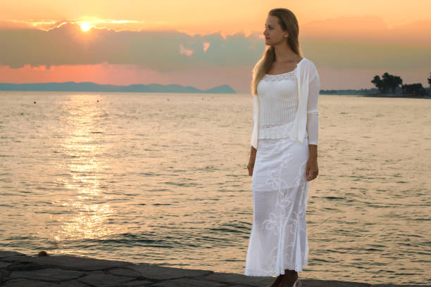 istock Young women enjoying her vacation at the beach 1399554631