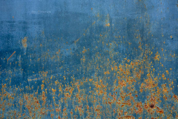 istock Closeup of a metal surface with streaks, rust and cracks. 1399555533
