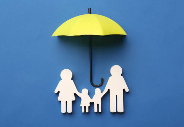 istock Mini umbrella and family figure on blue background, flat lay 1399555612