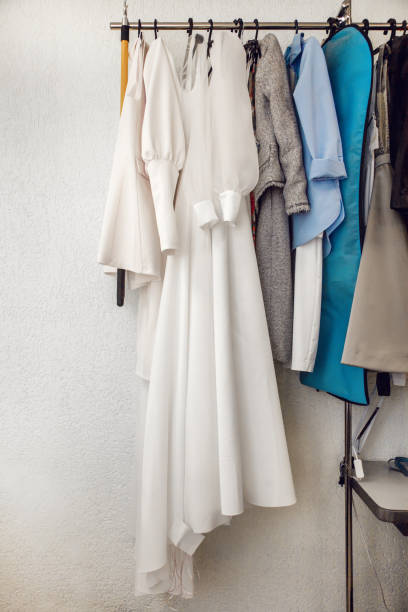 istock Different dresses hang on rail in the atelier 1399556166