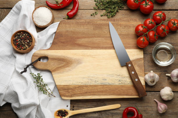 istock Flat lay composition with cutting board and ingredients on wooden table. Cooking utensils 1399556303