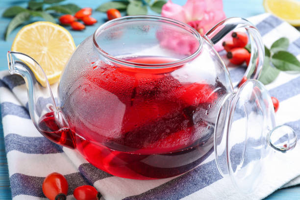 fresh rose hip tea and berries on table, closeup - dogrose imagens e fotografias de stock