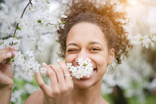 Beautiful woman enjoying in lavender scent