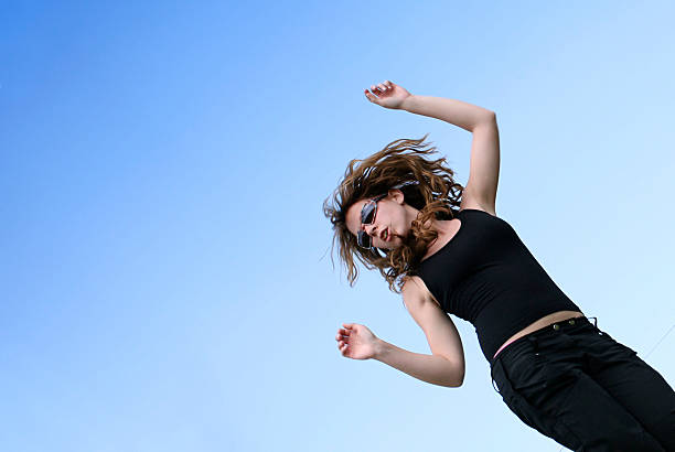 istock Happy woman against blue sky 139955796