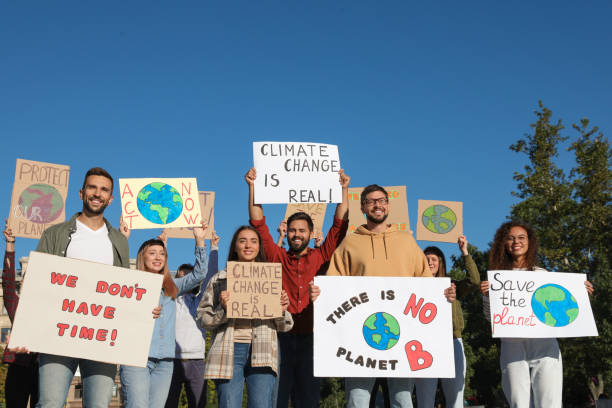 istock Group of people with posters protesting against climate change outdoors 1399558643