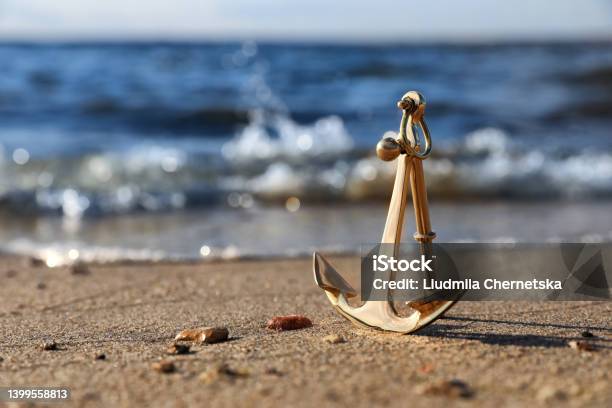 Metal Anchor Near River On Sunny Day Stock Photo - Download Image Now - Anchor - Vessel Part, Beach, Landscape - Scenery