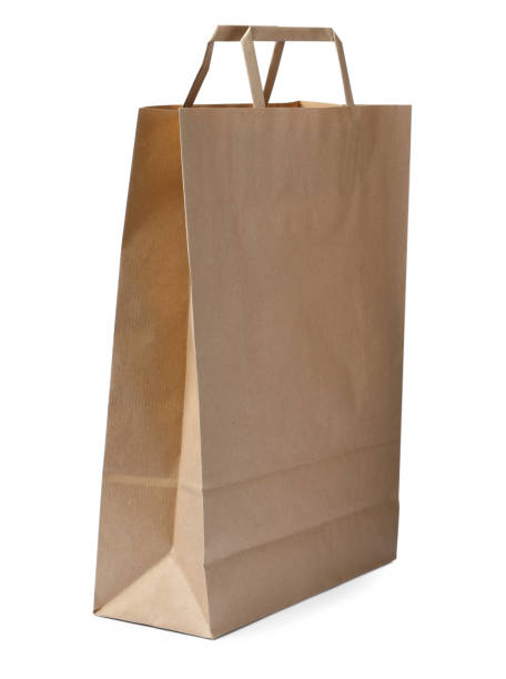 istock Kraft shopping paper bag isolated on white 1399559186