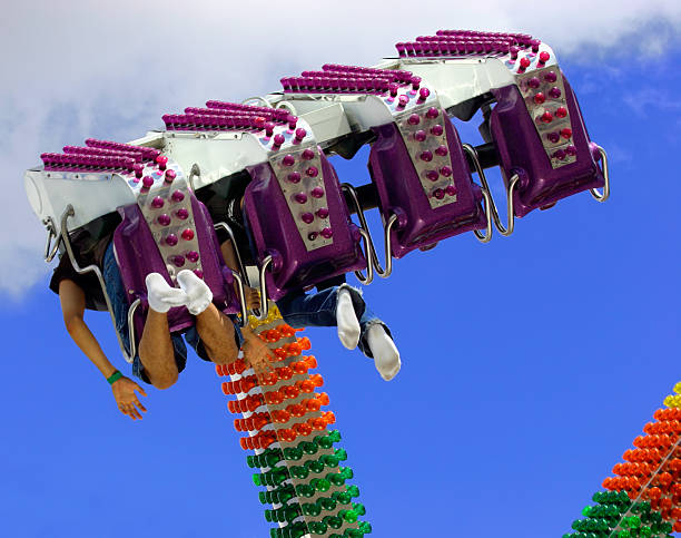 Amusement Ride View from under a ride at the amusement park. riveting stock pictures, royalty-free photos & images