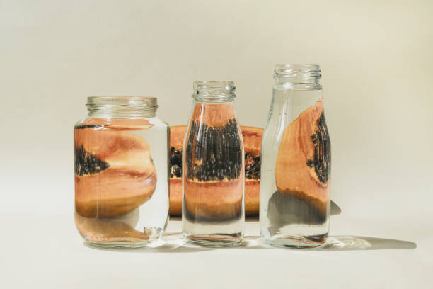 istock Fresh juicy halved papaya on beige background. 1399560542