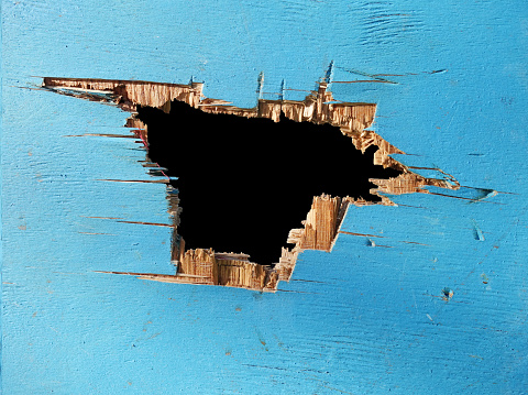 Close up shot of hole in a wall