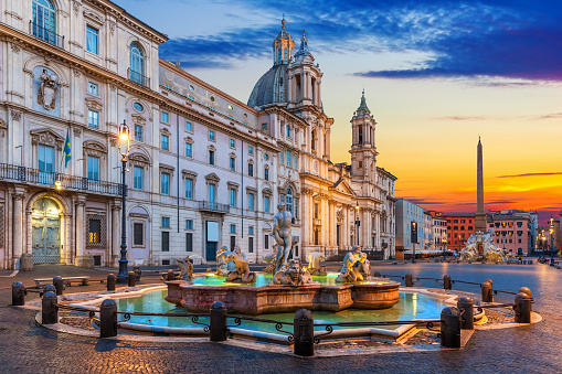 Famous Piazza Navona at sunset with buildings and Fountains, Rome, Italy.