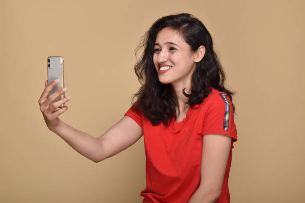 istock Young woman talking on video call using smartphone 1399565532