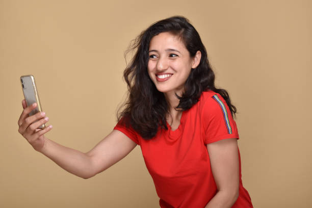 istock Young woman talking on video call using smartphone 1399565609