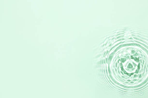 istock The texture of water on a green background. 1399570286