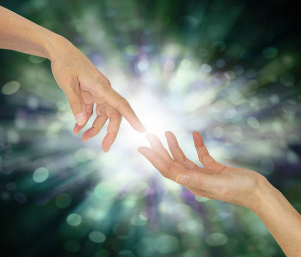istock Receiving a Reiki attunement concept 1399570921