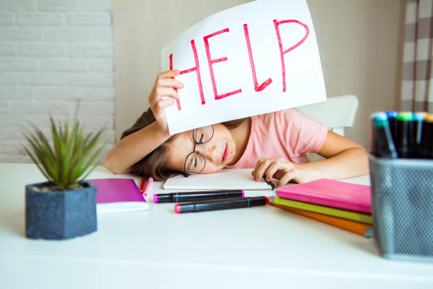 istock Selective focus of sad school kid holding paper with help lettering, bullying concept. Problems of growing up in adolescents 1399570940